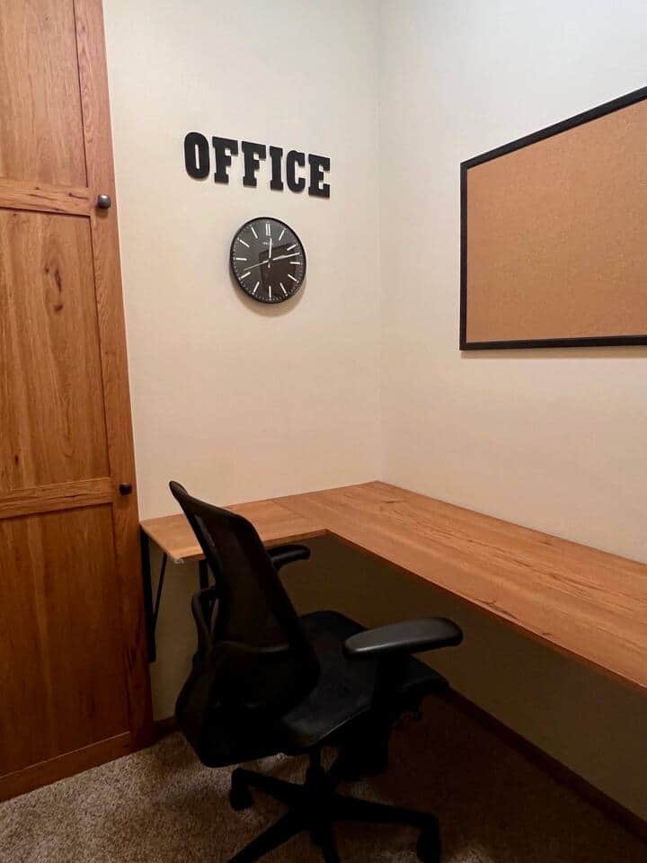 Office off primary bedroom features a printer and offers privacy for work calls