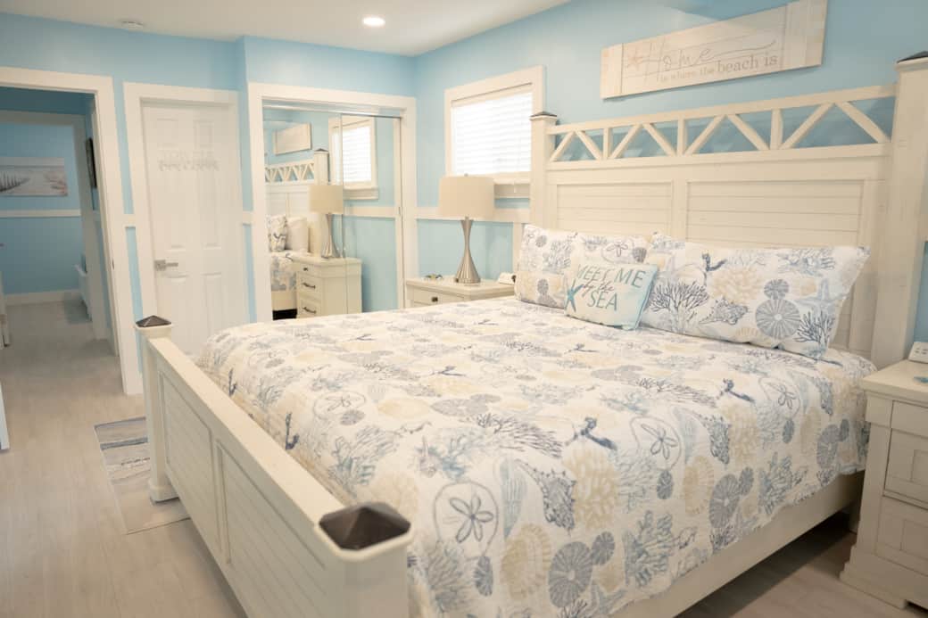 master bedroom w/ king bed, with slider to lanai