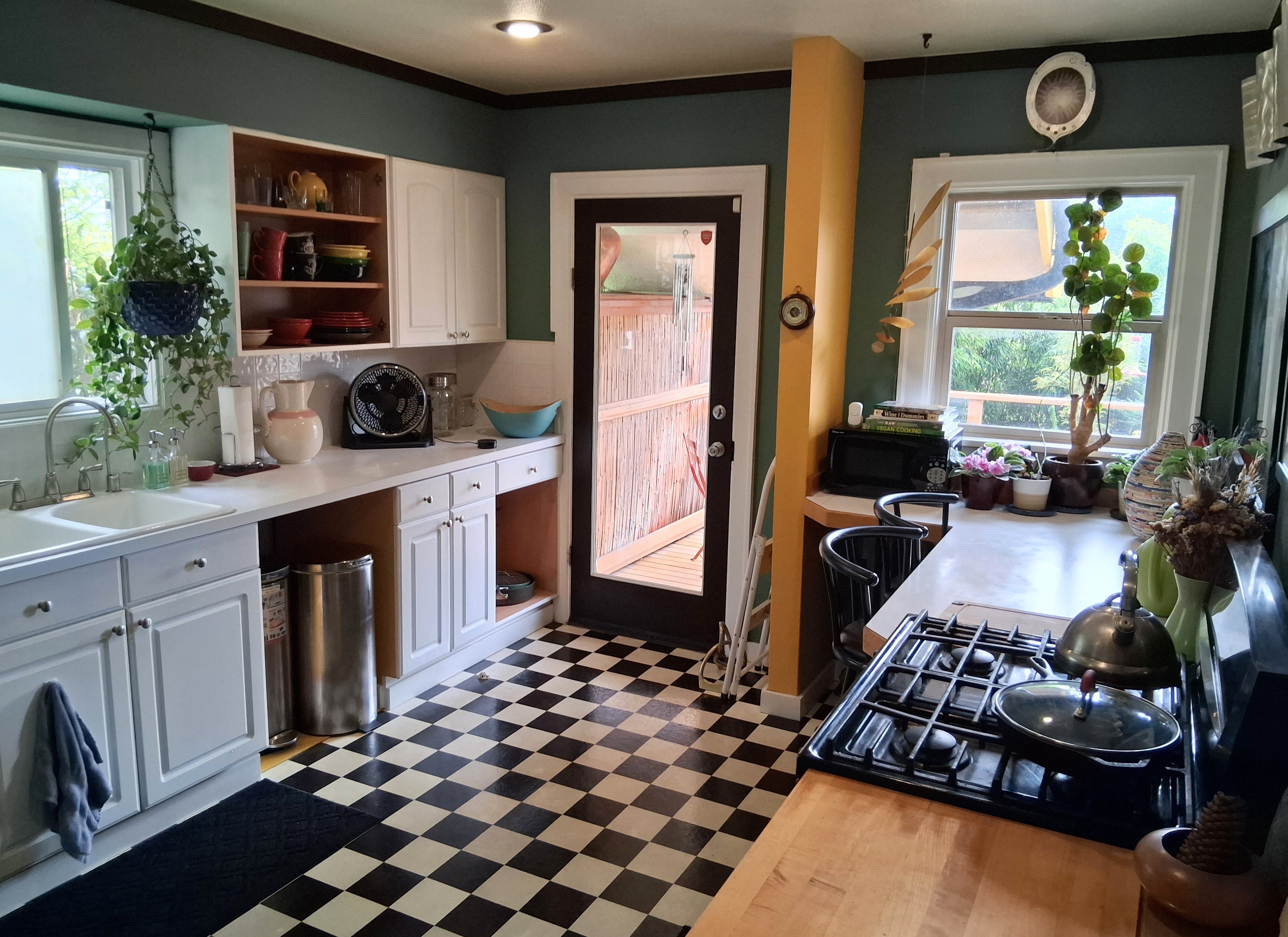 The full kitchen leads out to the back deck.