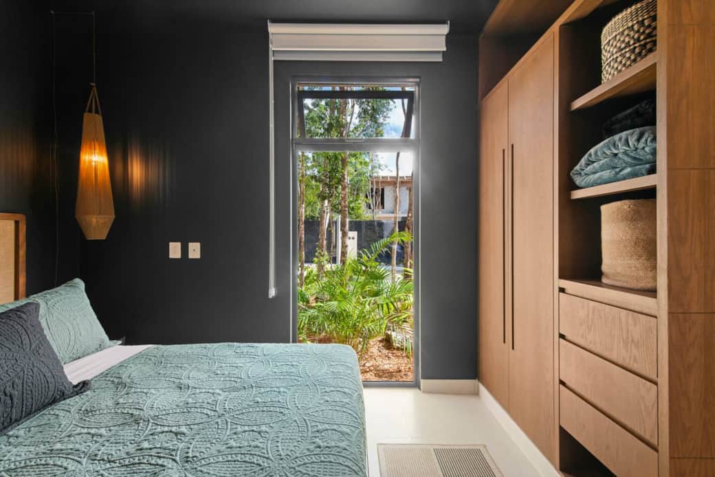 Not only does this cozy bedroom feature a king-size bed, bedside lamps, and easy-access light switches and outlets, it also includes A/C, a ceiling fan, room-darkening shades, and a full wardrobe for your belongings.