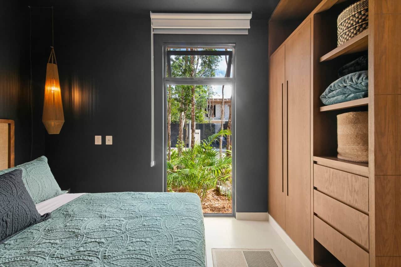Not only does this cozy bedroom feature a king-size bed, bedside lamps, and easy-access light switches and outlets, it also includes A/C, a ceiling fan, room-darkening shades, and a full wardrobe for your belongings.