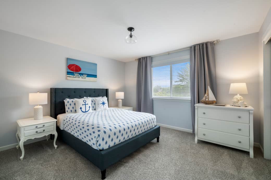 Bright and cozy queen bedroom, perfect for multi-generational families traveling together.