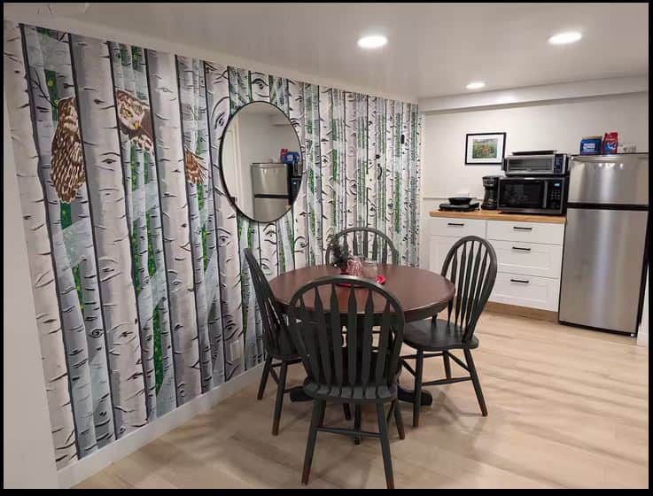 Kitchen and dining table with custom mural Kitchen and dining table with custom mural
