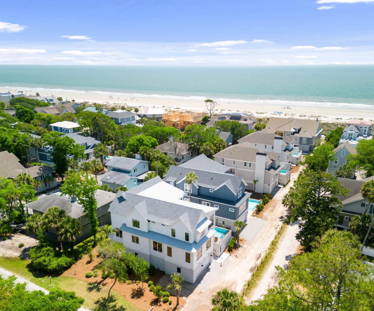 Drone shot of our 5th row  home, 100 steps to the beach 