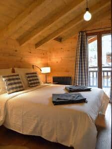 Bedroom 1 (the balcony looks towards the town centre and now has a round table and chair)