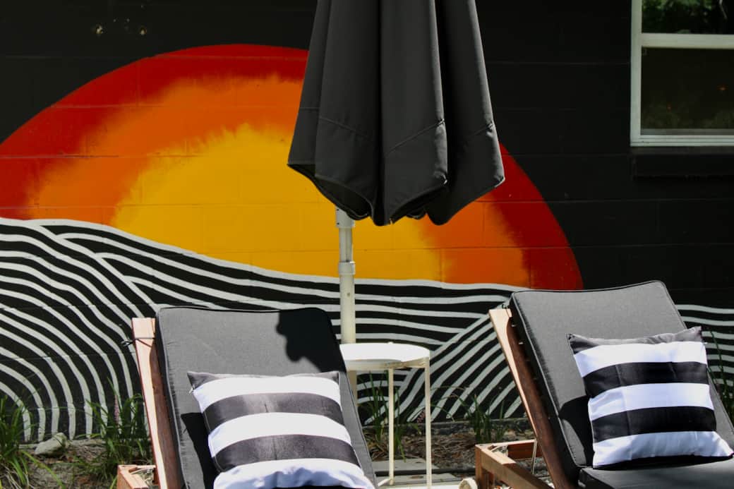 You can longue in style in our chairs and take a selfie by the sunset mural. You can longue in style in our chairs and take a selfie by the sunset mural.