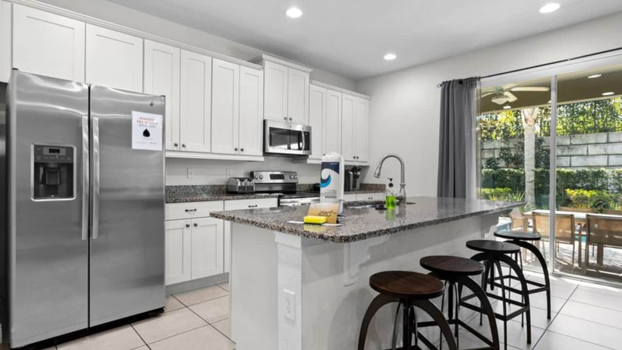 - Fully equipped kitchen with stainless-steel appliances and breakfast seating