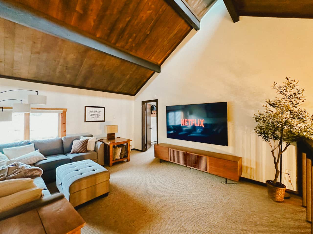 A second living area with an 85" smart TV and plenty of space to stretch out.