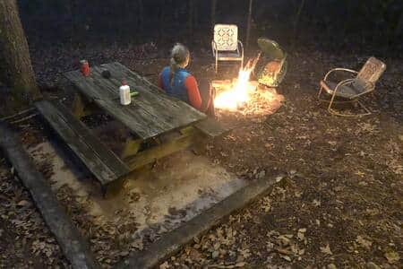 Private picnic table and firepit area just off the back porch
