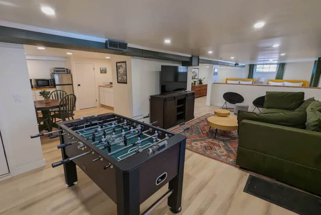 Living room with foosball table and kitchen Living room with foosball table and kitchen