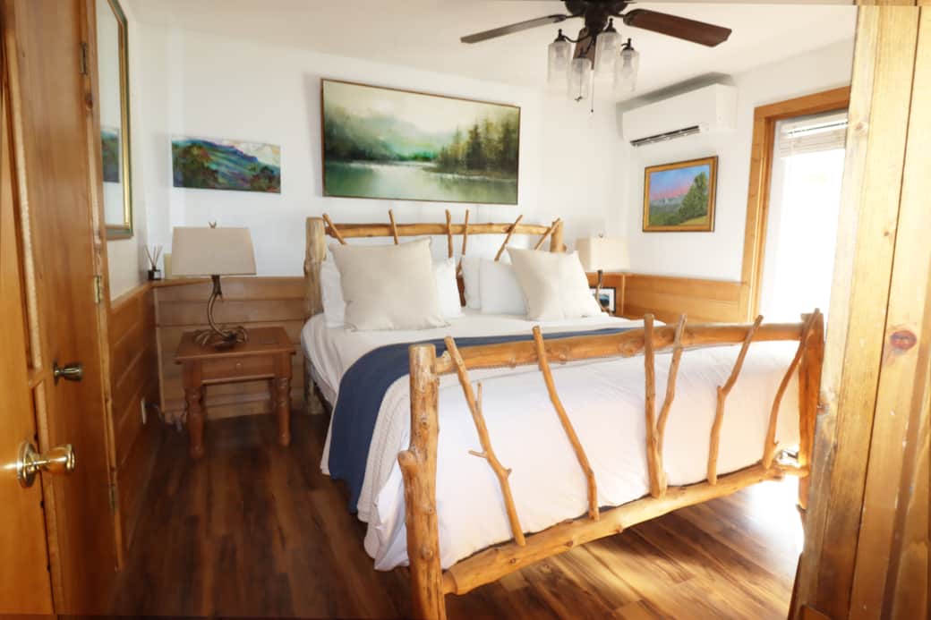 Your king bed leads out to the screened in porch with fire table and
