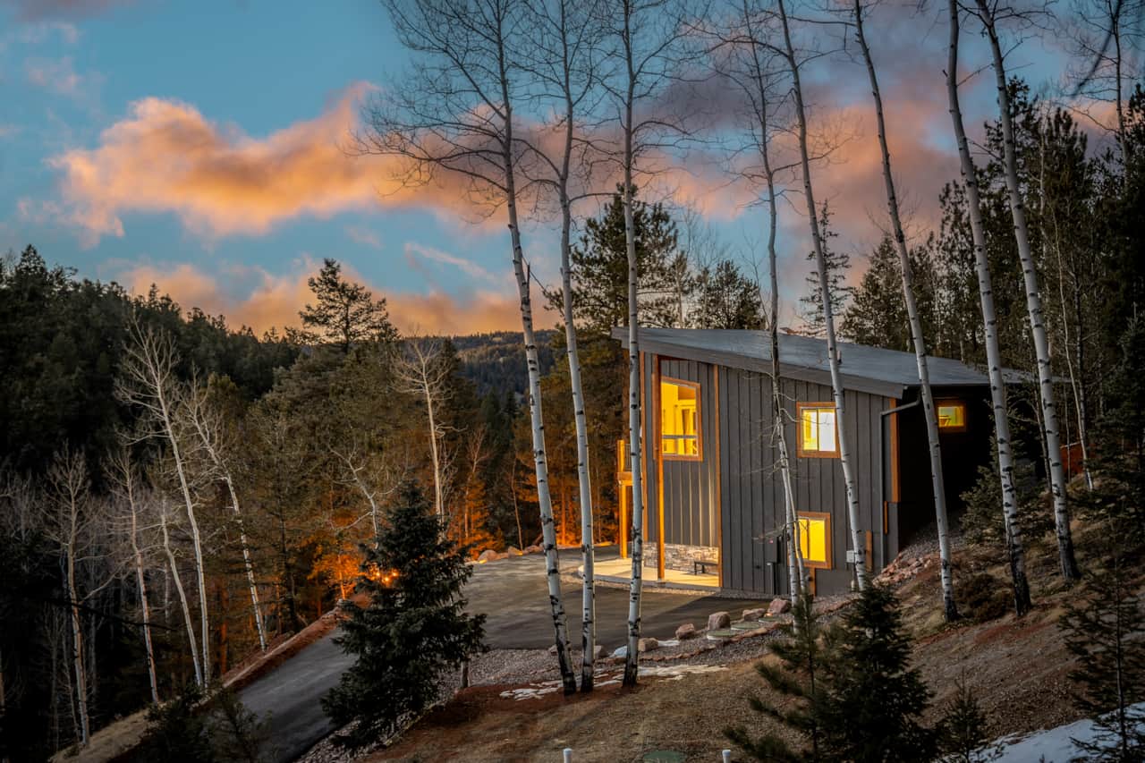 The property is perched on a hillside among groves of Aspen and Pine trees.