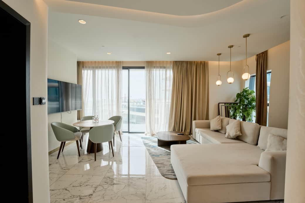 Bright Living Area with Balcony and Dining Space Bright Living Area with Balcony and Dining Space