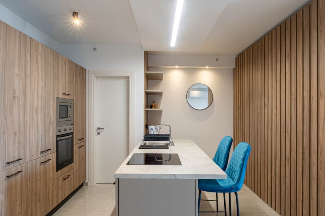 Kitchen with island with barstyle seats
