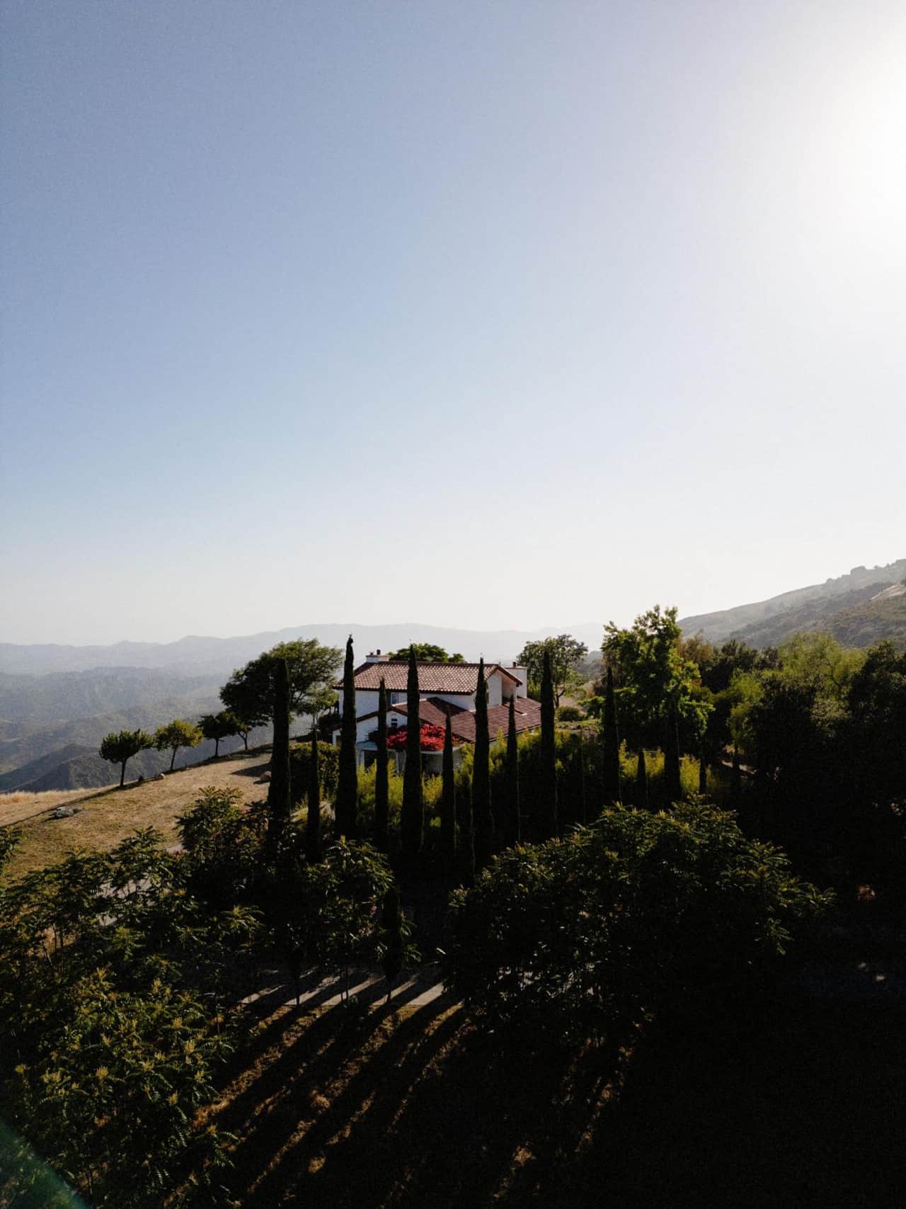 View south toward the Pacific, with the house among the cypresses