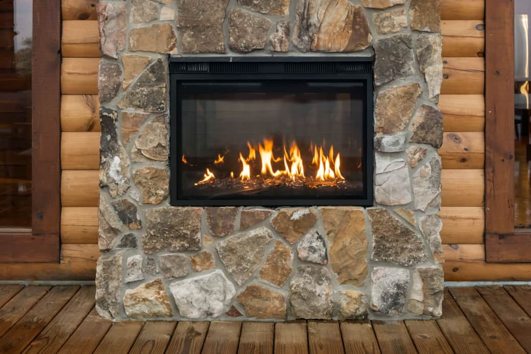 Indoor/outdoor gas fireplace seen from the deck