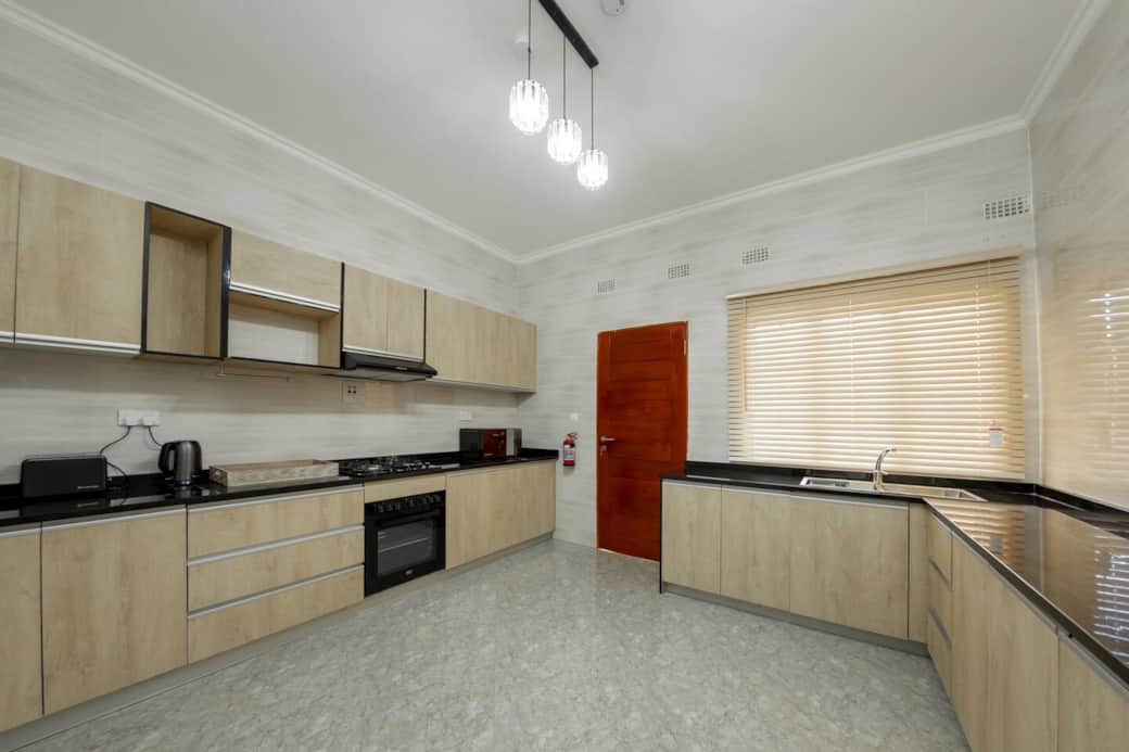 Fully equipped kitchen with modern appliances and storage 