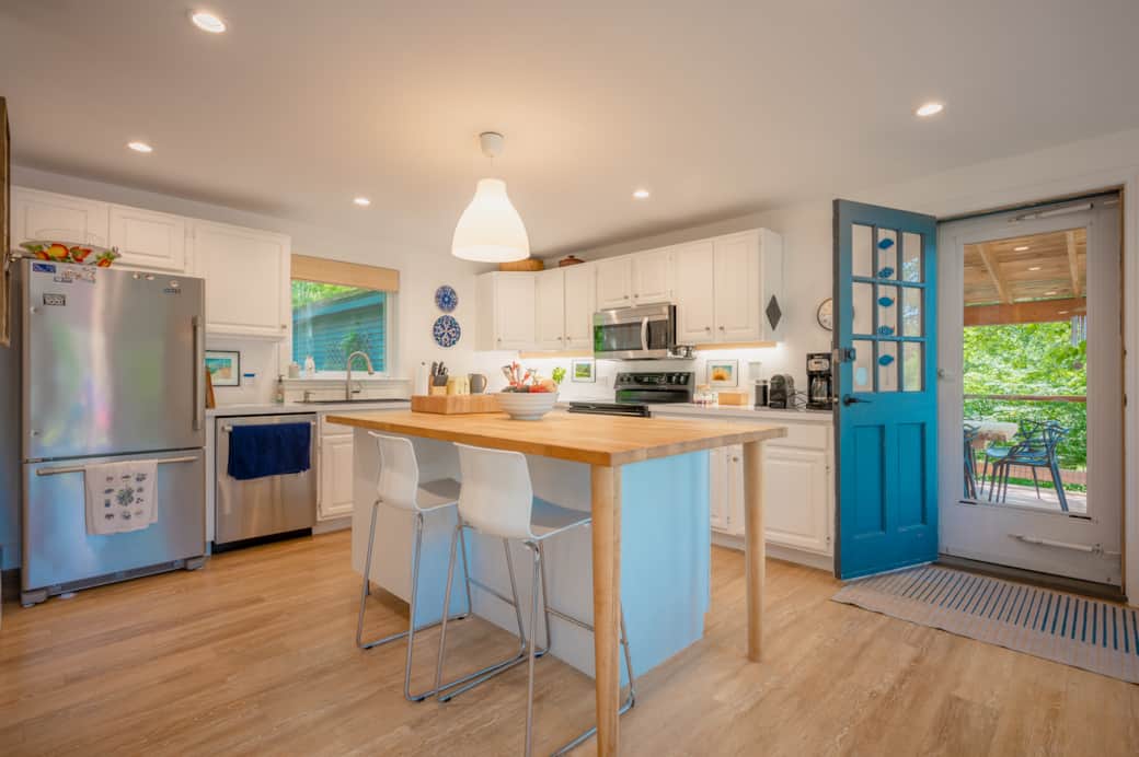 Step into the open kitchen and dining room when you arrive