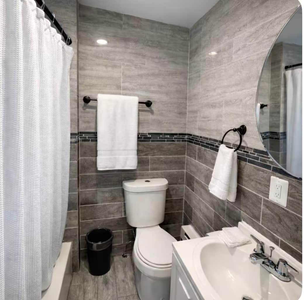Full bathroom with bathtub.
