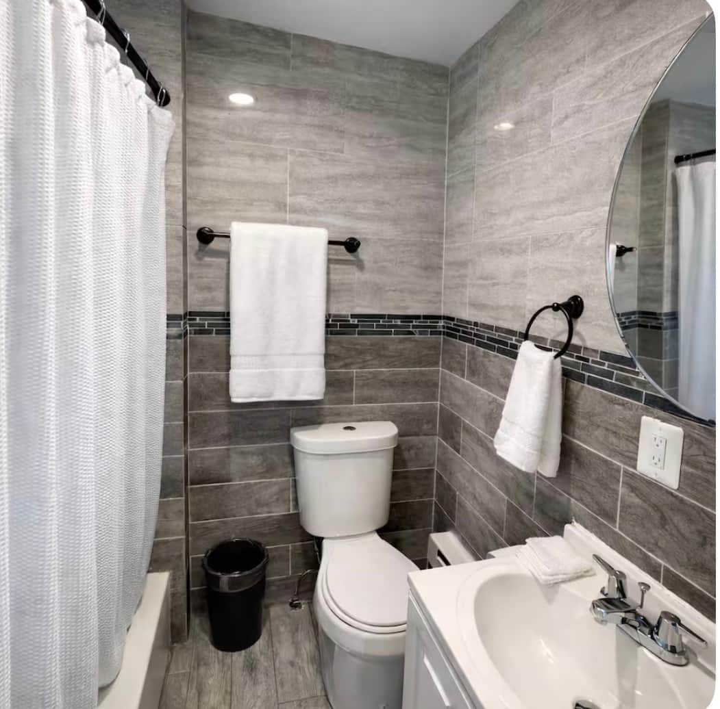 Full bathroom with bathtub.