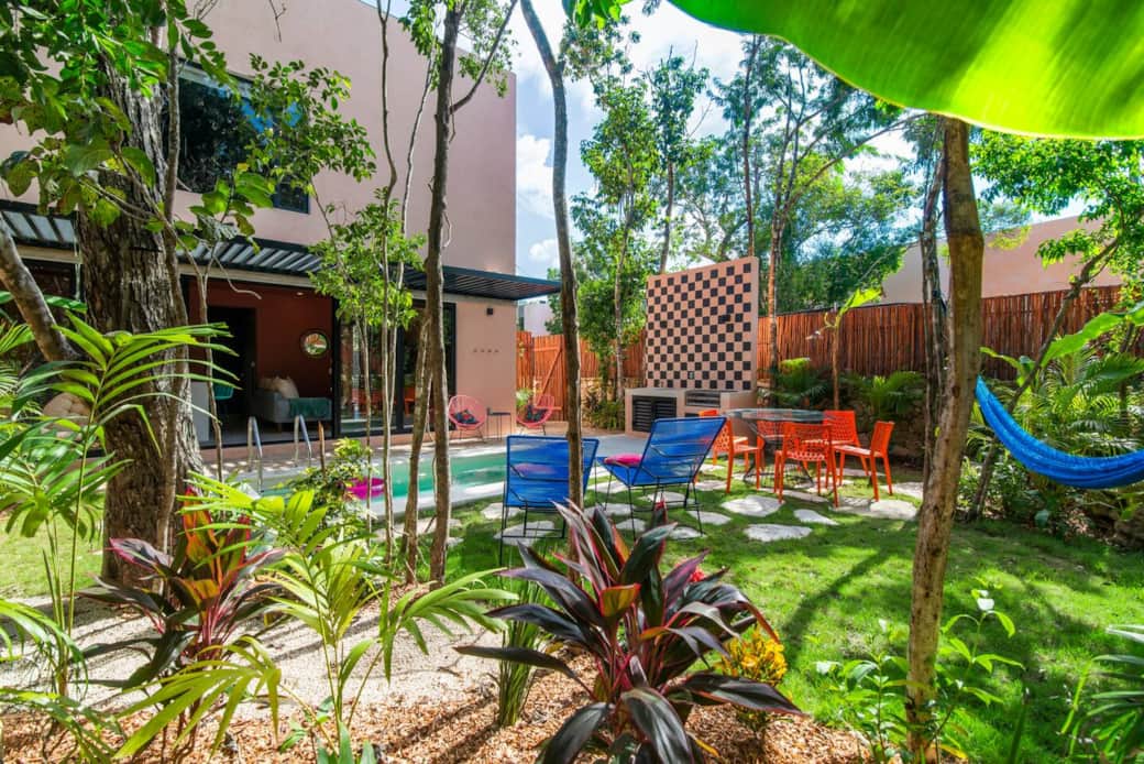 Enjoy your private backyard oasis with a refreshing pool, BBQ grill, outdoor dining area, wet bar with sink, loungers, a hammock, and a hanging chair—perfect for relaxing, soaking up the sun, and enjoying your stay.