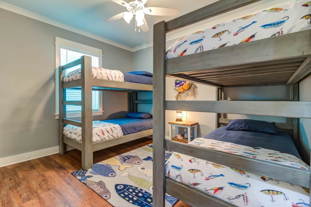 Fun bunk room perfect for kids or friends with coastal decor
