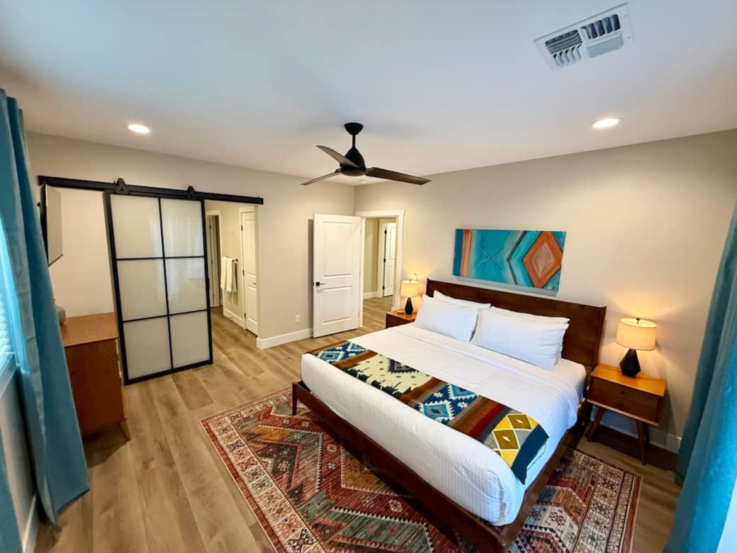 View of master bedroom from double glass sliding doors to courtyard.