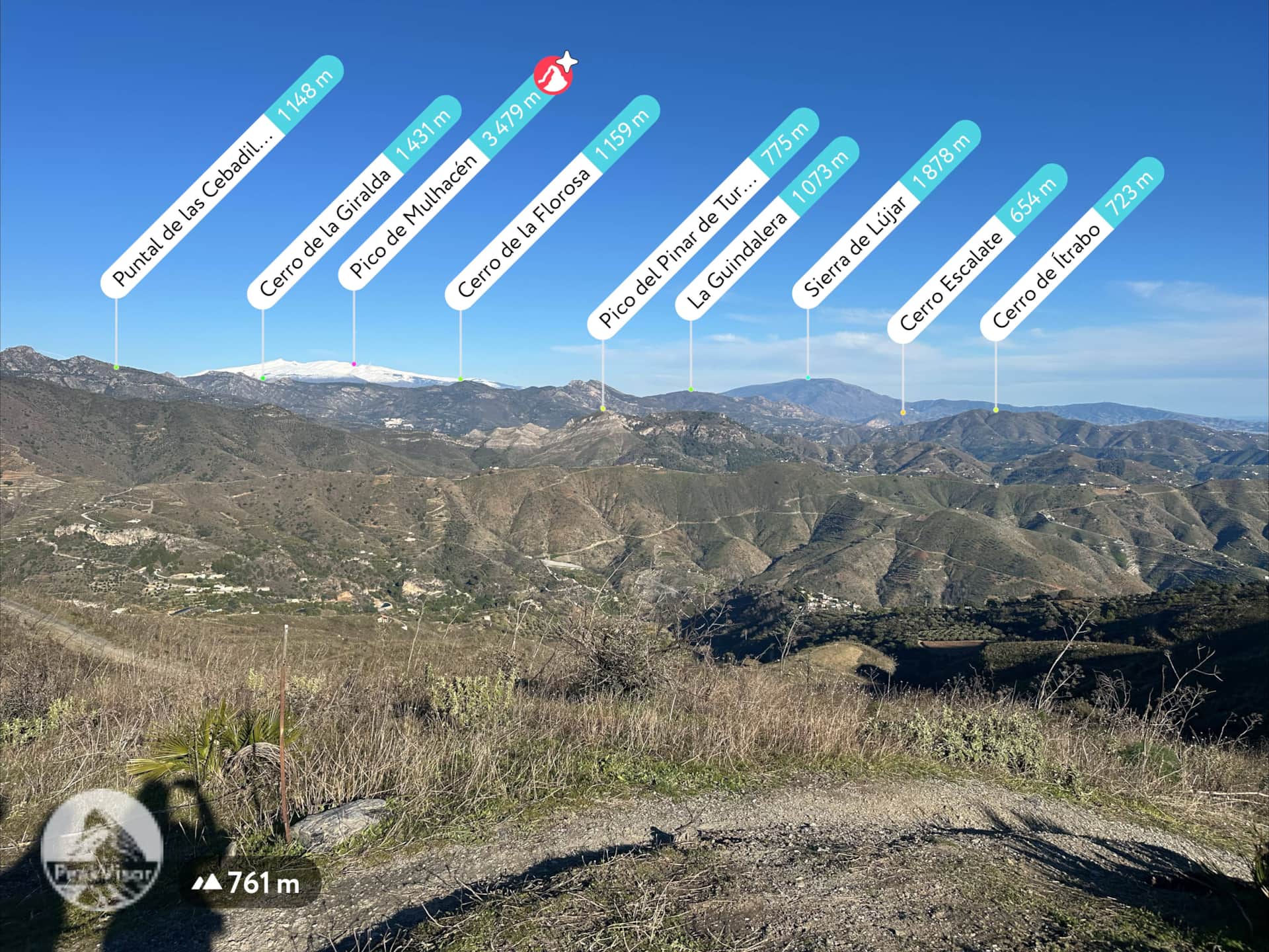 Winter view from a mountain above La Herradura on the Costa Tropical, with labeled mountain peaks including Sierra Nevada and Pico del Mulhacén.