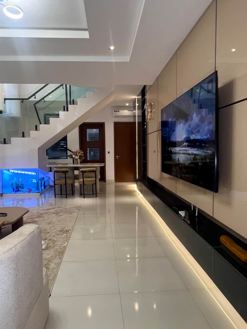 Living room with large TV and seating