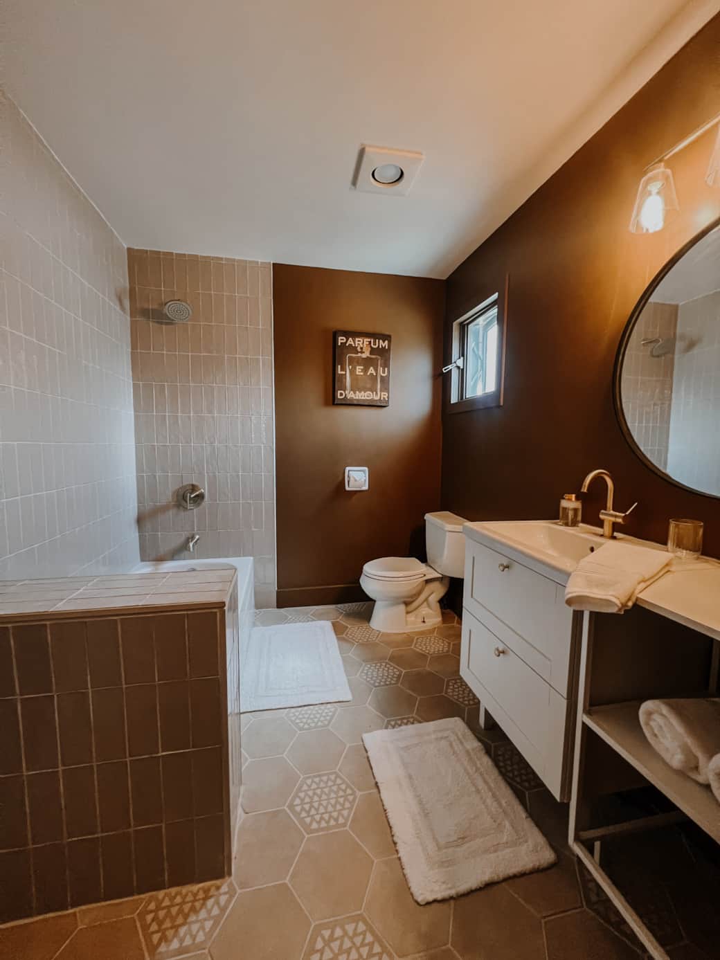 Rustic ensuite with earthy finishes, soft glow, and a modern mountain vibe.