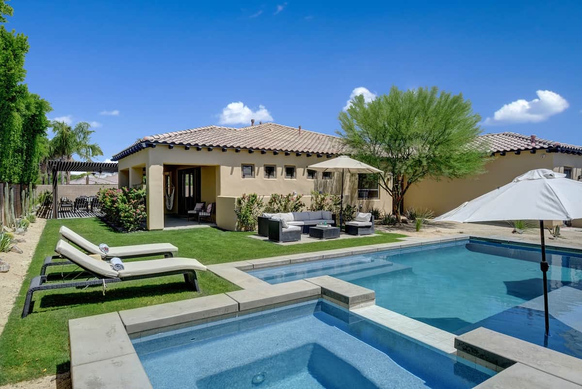 Relax in the outdoor living room or suntan on the recliners. Pool is 4' shallow to 6' deep. Simple remote to control the pool lights, spa on/off and spa jets. No fake grass here!