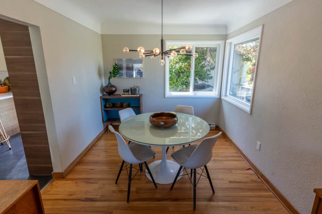 Vintage tulip table in the bright dining room.