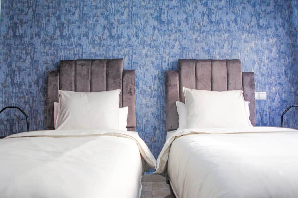 Like to keep the bedsheets all to yourself? The bedroom with two single beds might be the best choice for you.