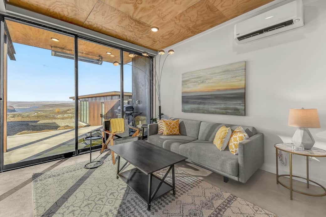 Living Room & View.  This is a back row unit but the homes in front are much wider than most so the beautiful Columbia River Gorge view is really wide.