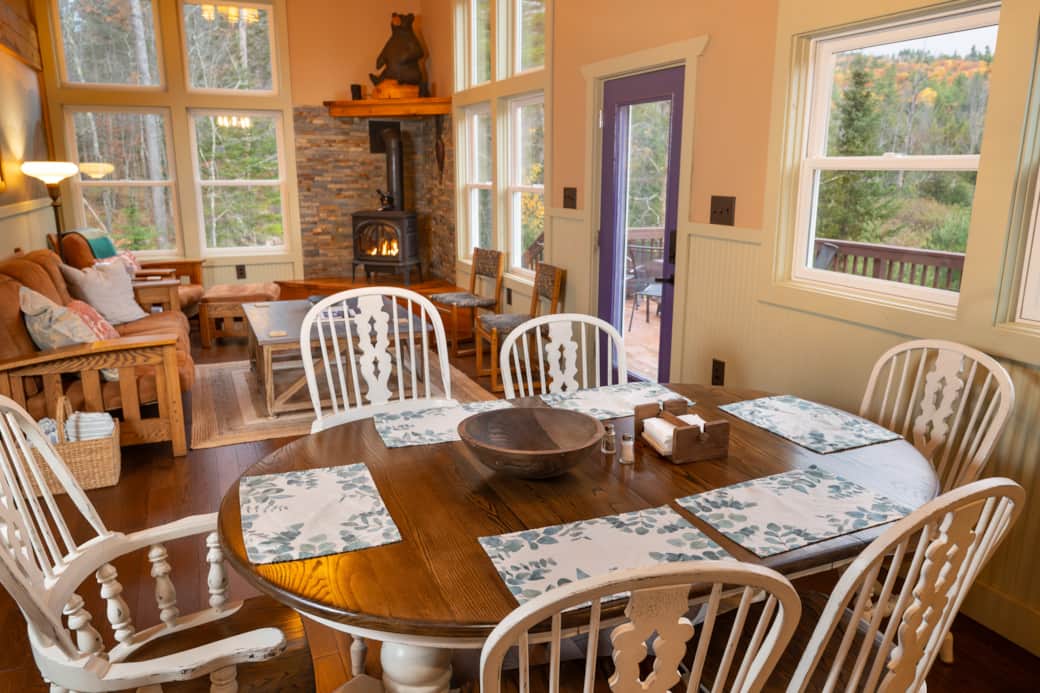 The dining area is set for 6. Chairs can be brought over to comfortably seat 8. The dining area is set for 6. Chairs can be brought over to comfortably seat 8.