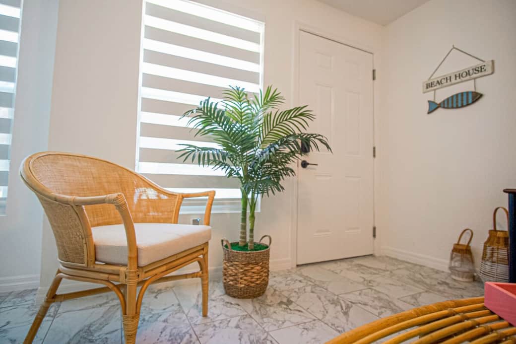 Cozy accent chair by the entry—an inviting spot to unwind.