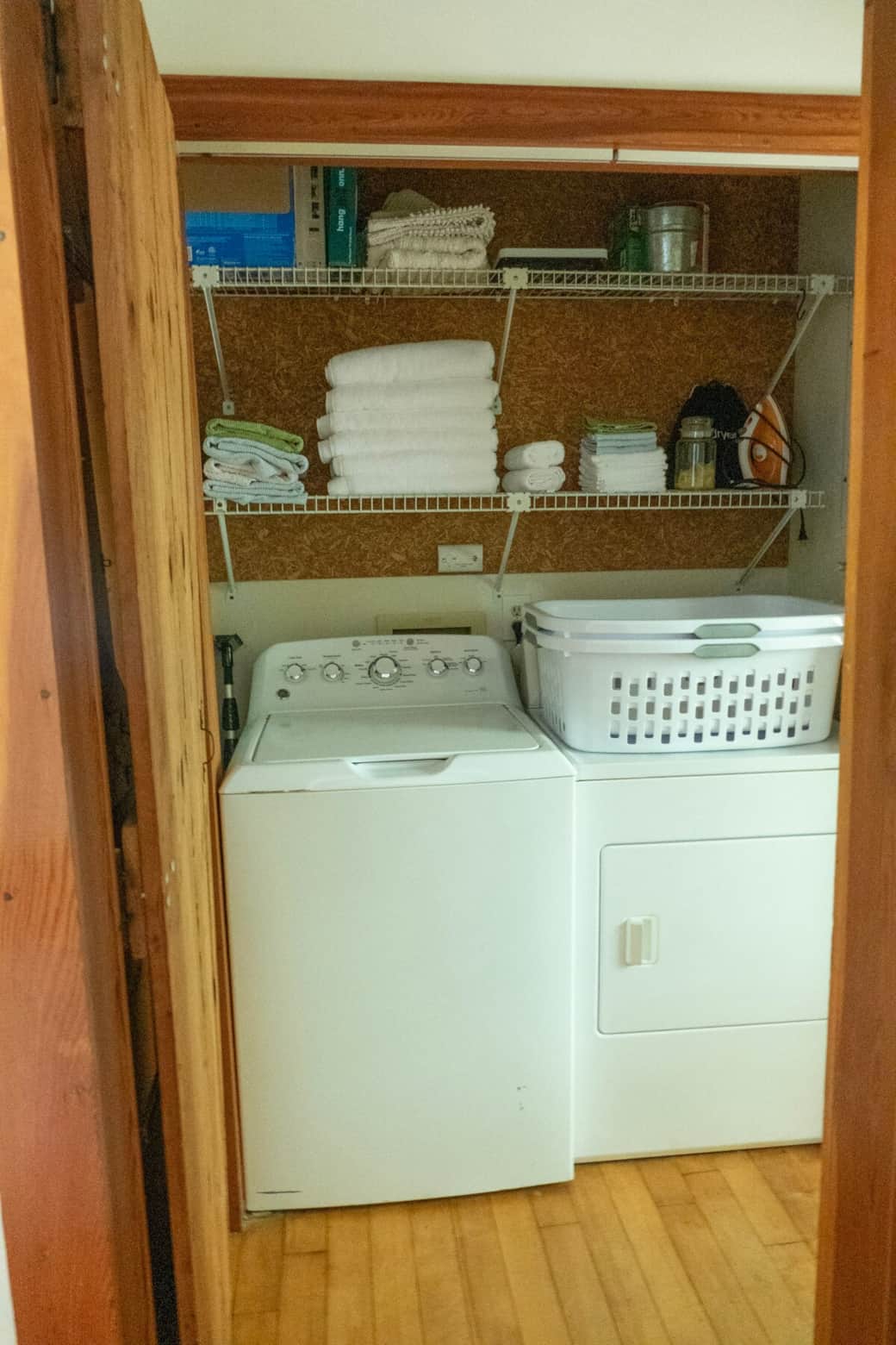 Just through the bathroom door, you'll find the washer and dryer along with towels and washcloths, detergent, iron, and hair dryer. 