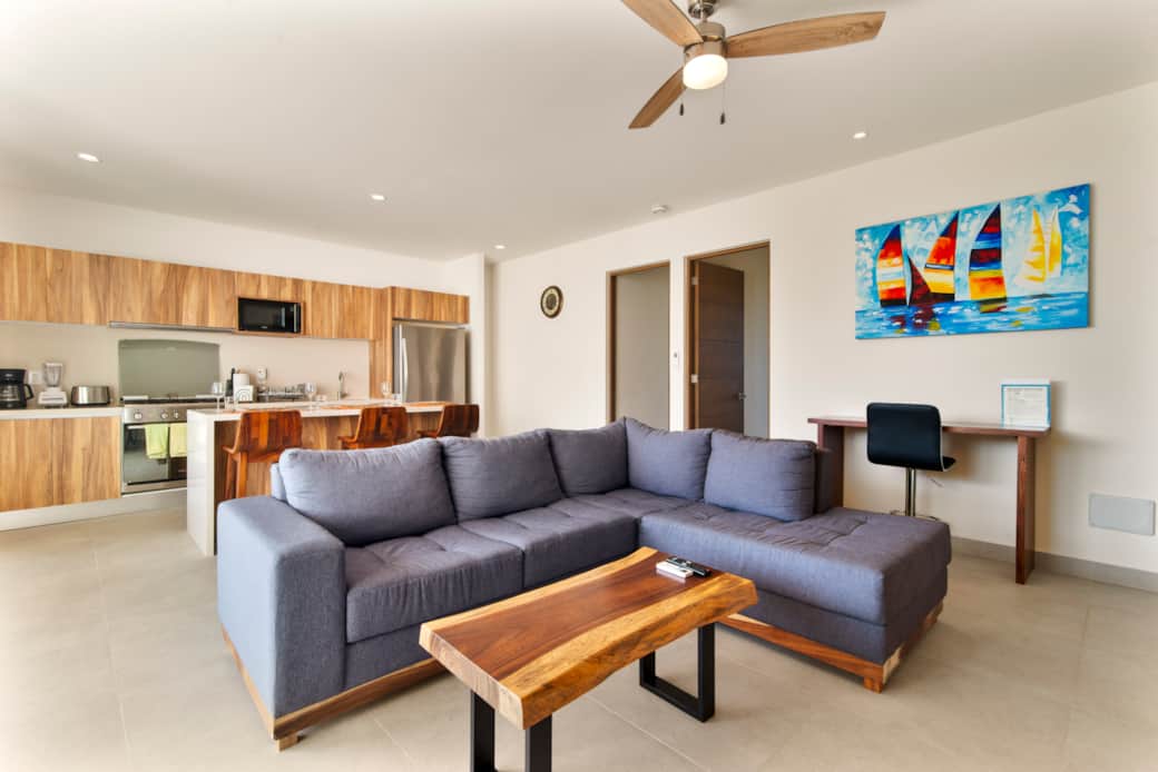 Unwind with loved ones in a cozy living room with TV & workspace.