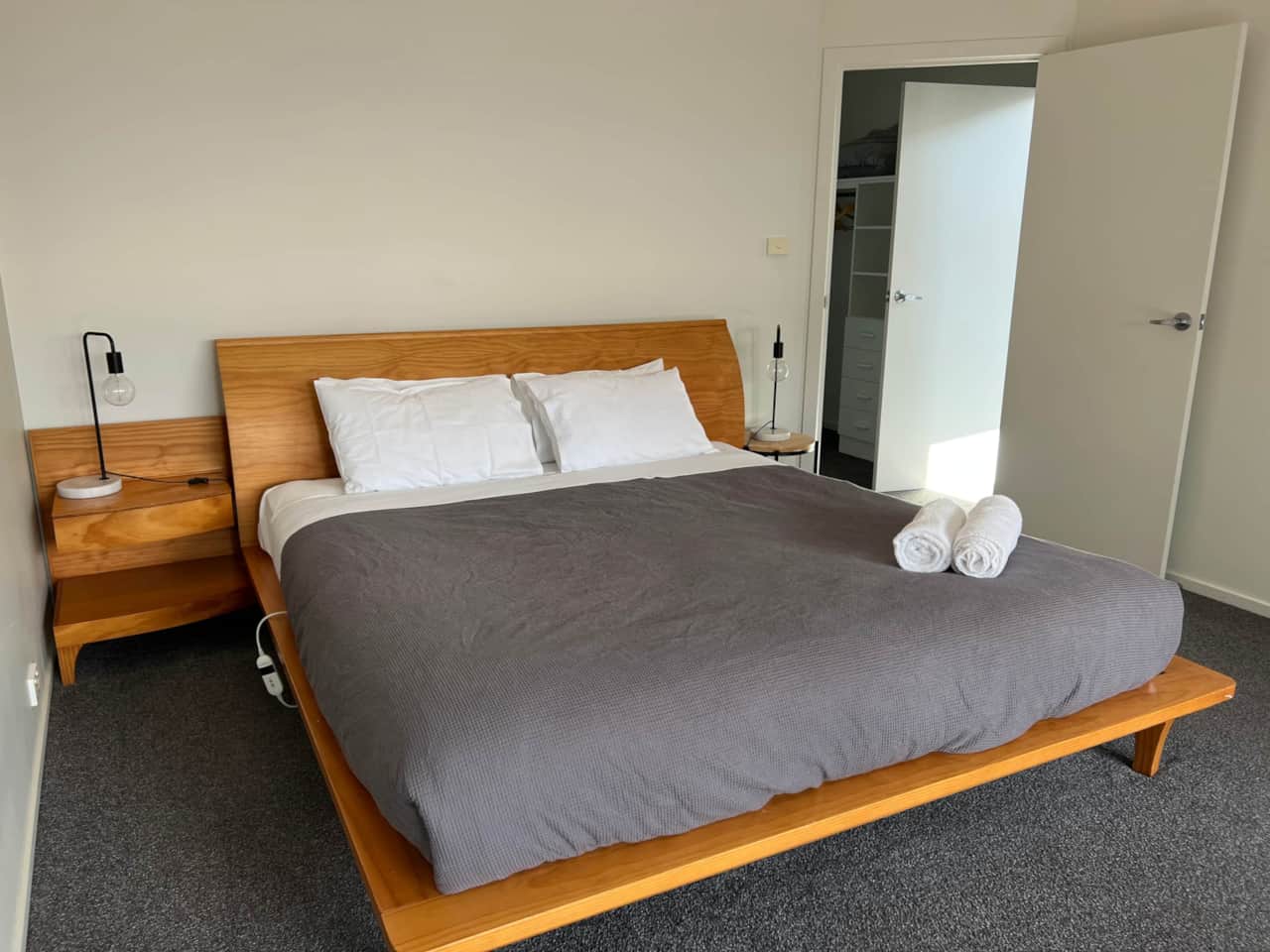 Indulge in luxury in Bedroom 1 w/ a spacious walk-in robe and private ensuite for ultimate comfort.