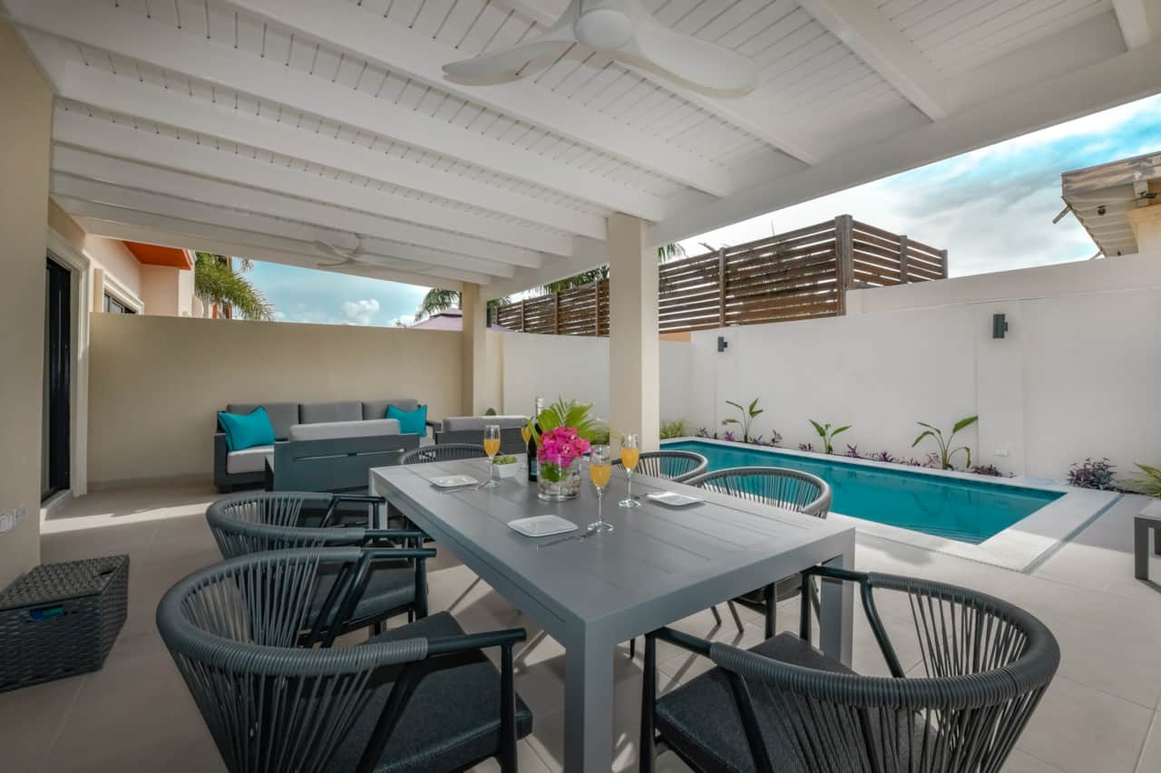 pergola-covered dining area in private backyard