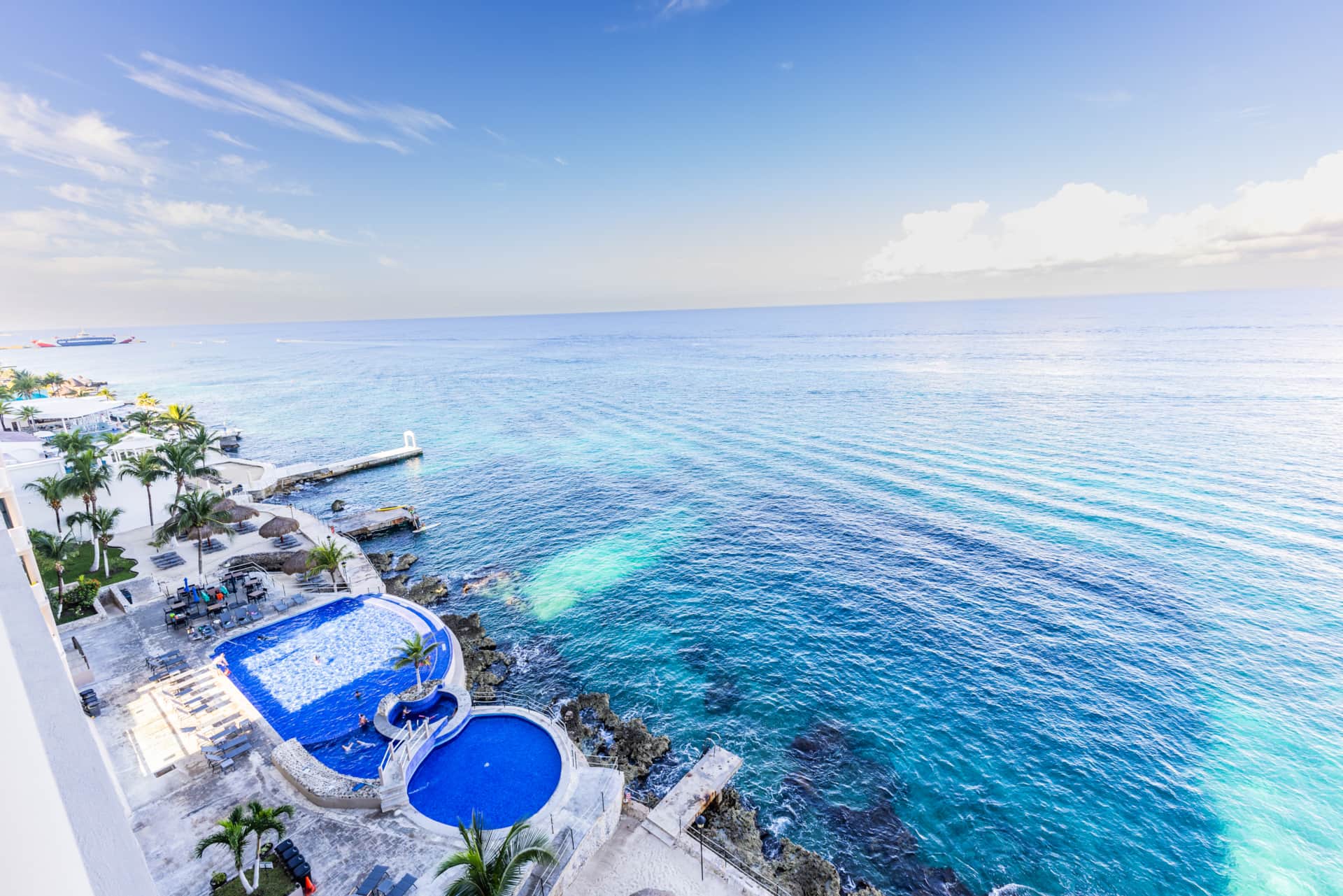 Sunset oceanfront view from the El Cantil heated infinity pool — Casa Graciela Cozumel