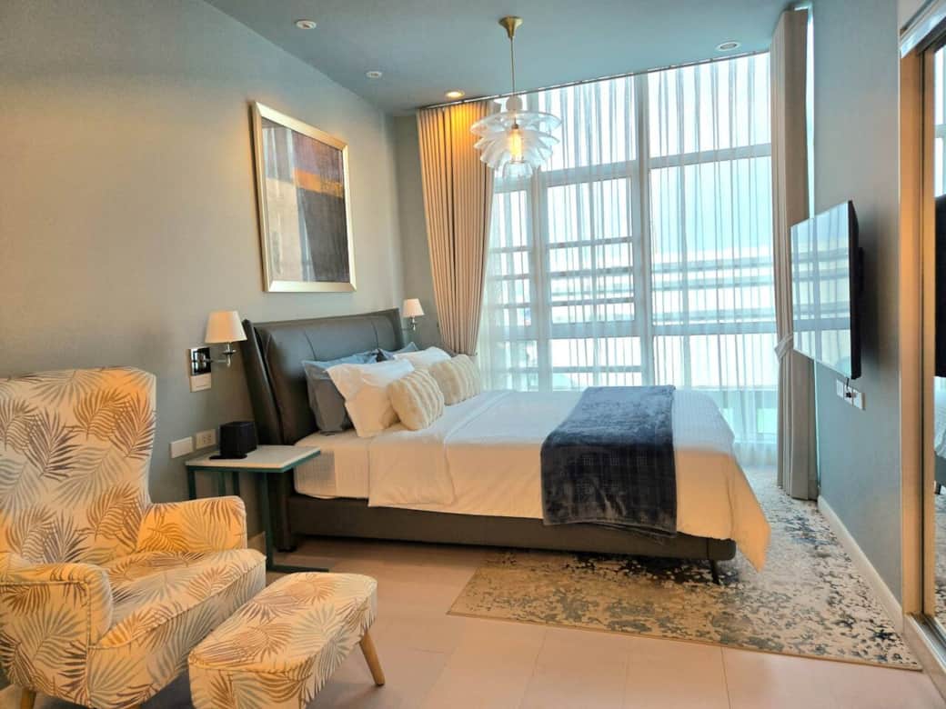 The main bedroom is spacious and relaxing, featuring a cozy queen bed, plush linens, a comfy ottoman chair, and a 55-inch smart TV for your comfort.
The main bedroom is spacious and relaxing, featuring a cozy queen bed, plush linens, a comfy ottoman chair, and a 55-inch smart TV for your comfort.