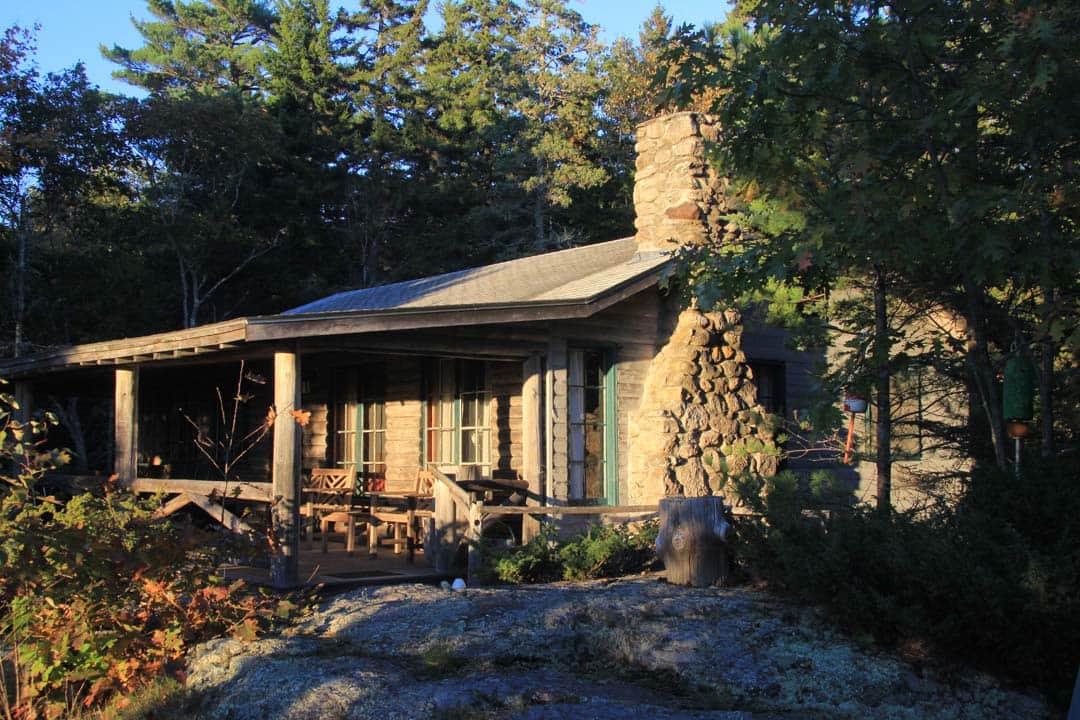The morning sun creates a warm glow on the face of Crow’s Nest Cottage.
