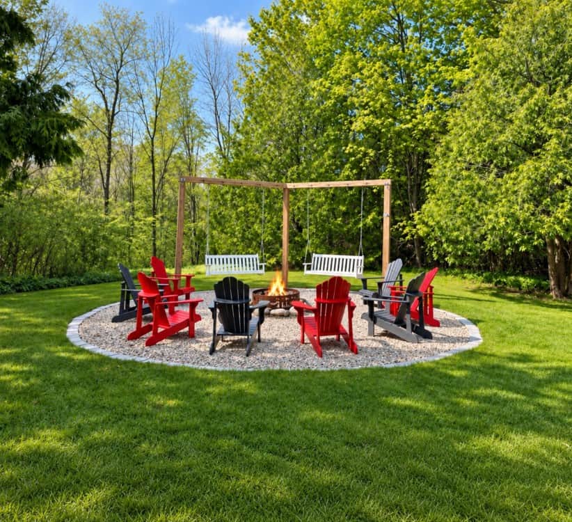 The outdoor living space offers spectacular views of the gardens and riverfront and includes a fire 