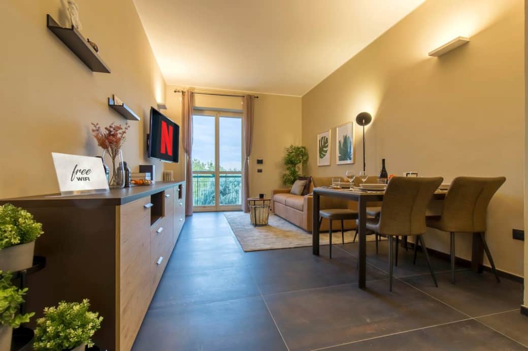 Modern and bright living area overlooking the green of Piazza Napoli and the rooftops of Milan Modern and bright living area overlooking the green of Piazza Napoli and the rooftops of Milan