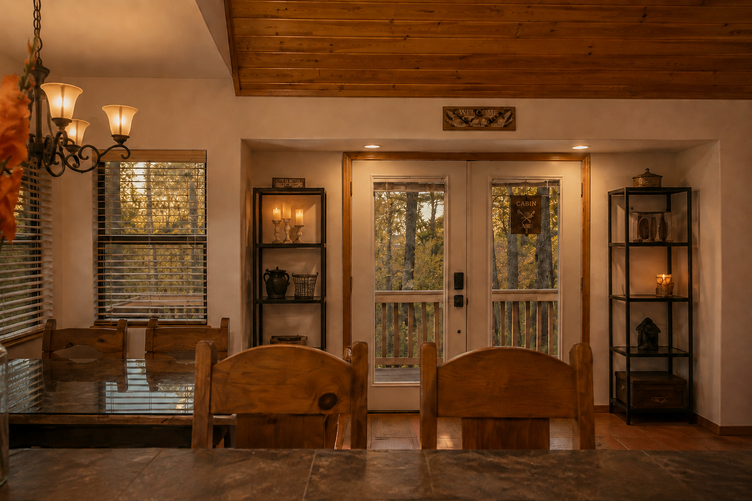 Dining area with deck access in dog-friendly mountain cabin