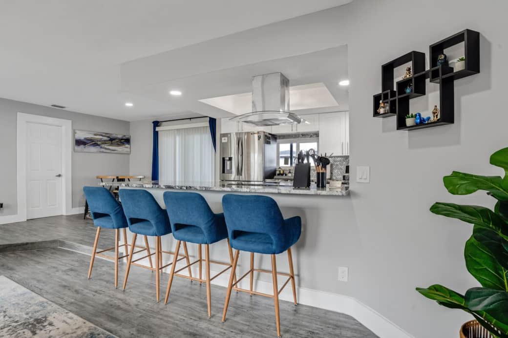 Stylish breakfast bar with comfortable seating, perfect for casual meals or gathering while cooking. Open-concept layout keeps everyone connected, making it easy to enjoy conversation and time together.