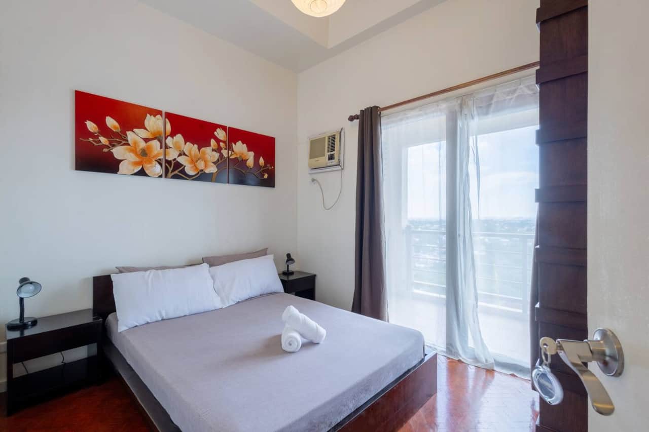 The Queen Suite:- 3 Panel Orchid Flower Canvas - queen sized Philux bed frame in Mahogany hardwood w/ assorted 2 night tables with drawer- 1.5 HP window type AC- full set of bed sheets provided