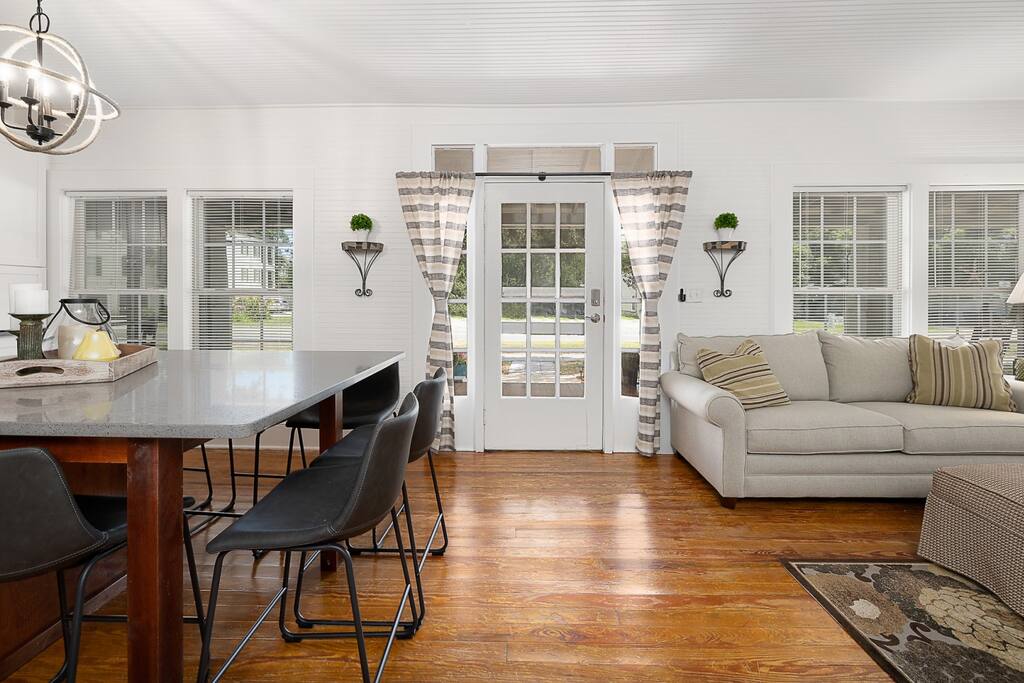 Entry with living area on right and kitchen/dining on left