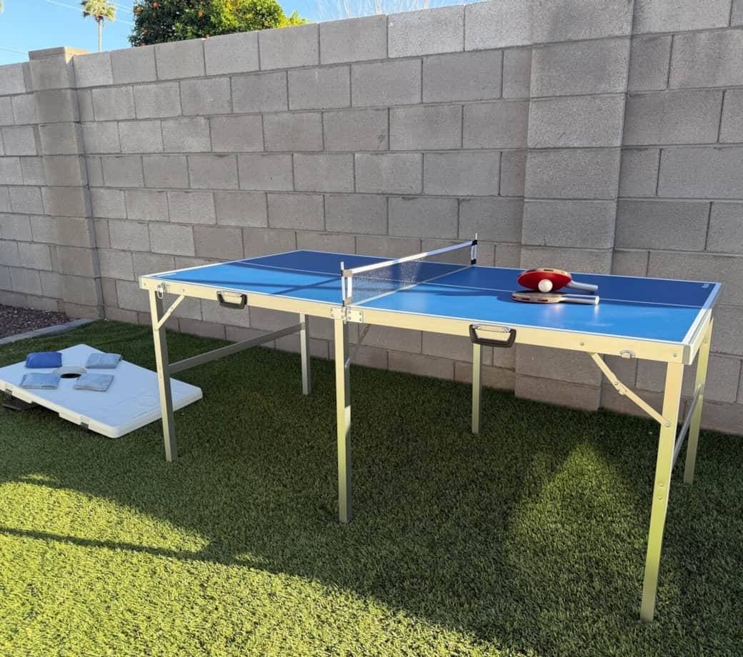 Challenge your group to a game of ping pong or cornhole on the backyard lawn. Portable 3' x 6' table can be played in the sun or shade, or be used to extend the outdoor dining area. 